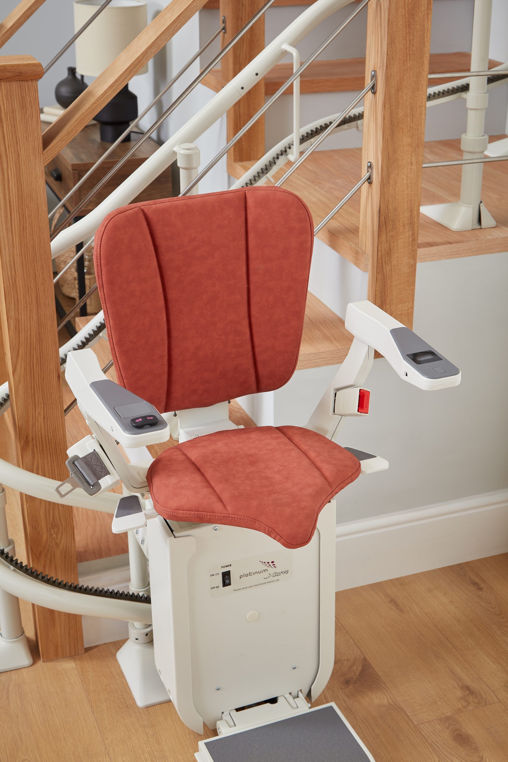 The Platinum Ergo Plus Curved Stairlift - Ruby Red